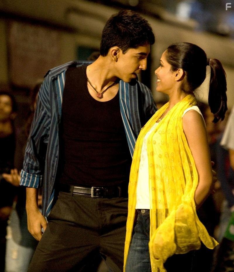 Dev Patel and Freida Pinto in Миллионер из трущоб (2008)