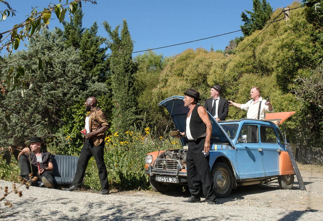 Conor Lovett, Mike Pickering, Sylvain Thirolle, Richard Henry, James Lailey, and Daniel-Konrad Cooper in The Man in the Hat (2020)