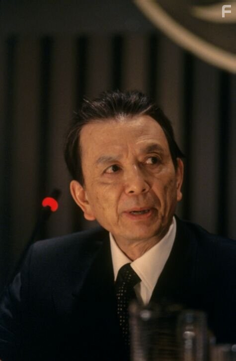 James Hong appears as Ambassador Wu