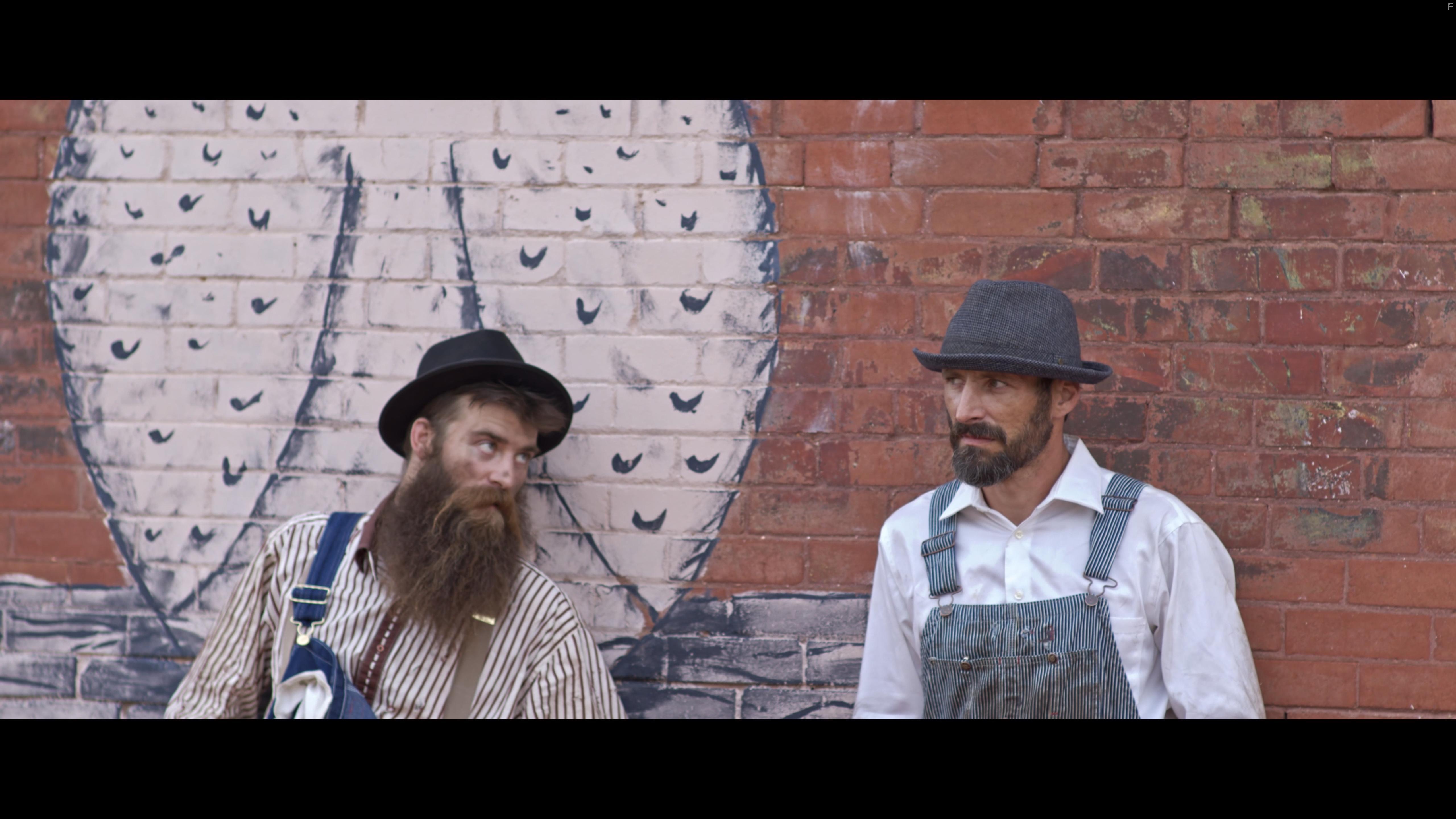 Mitch Yoder and Adam Modisette in Black Wall Street Burning (2020)