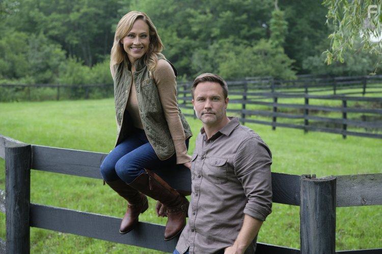 Nikki Deloach and Scott Porter in Taking the Reins (2021)