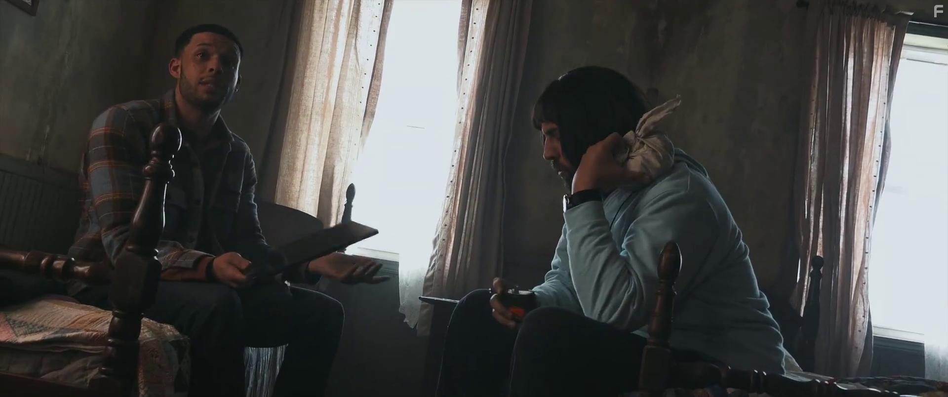 Dan Lippert and Roland Buck III in Paranormal Activity: Next of Kin (2021)