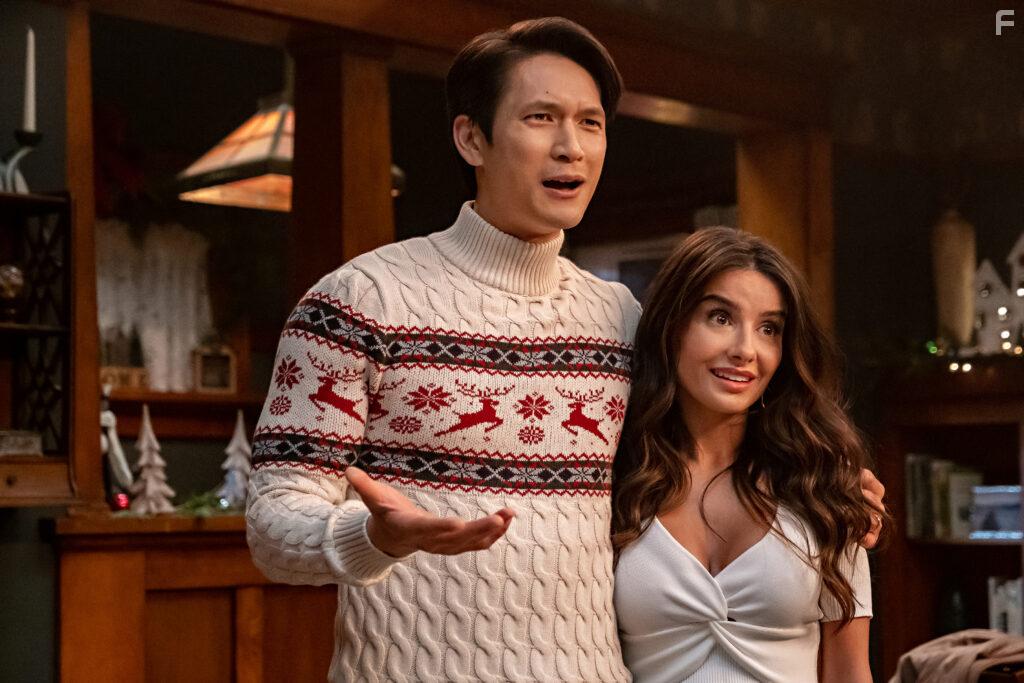 Harry Shum Jr. and Mikaela Hoover in Love Hard (2021)