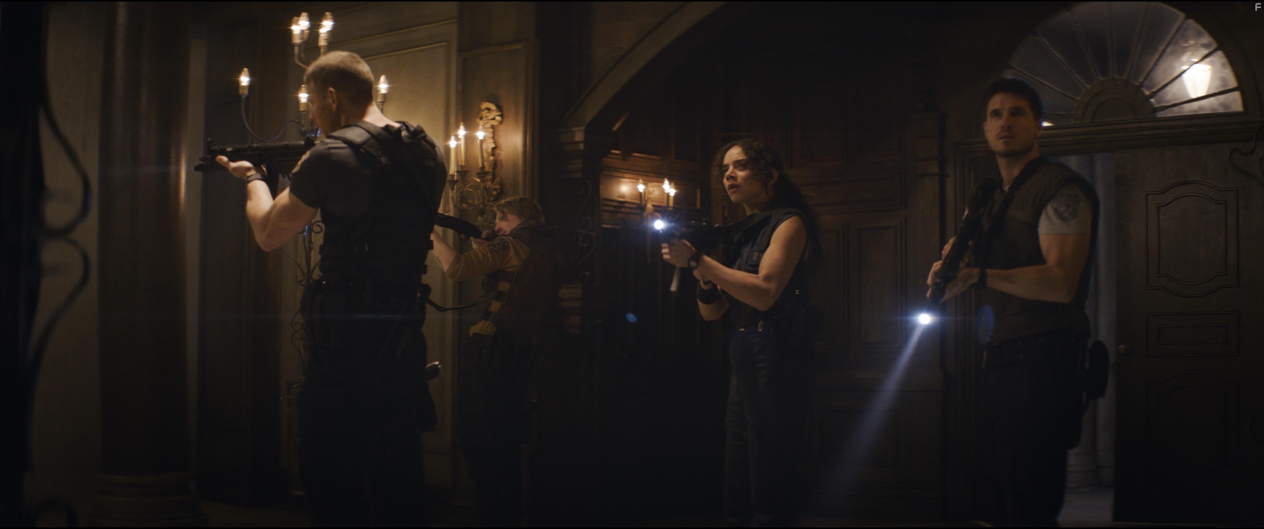 Robbie Amell, Tom Hopper, and Hannah John-Kamen in Resident Evil: Welcome to Raccoon City (2021)