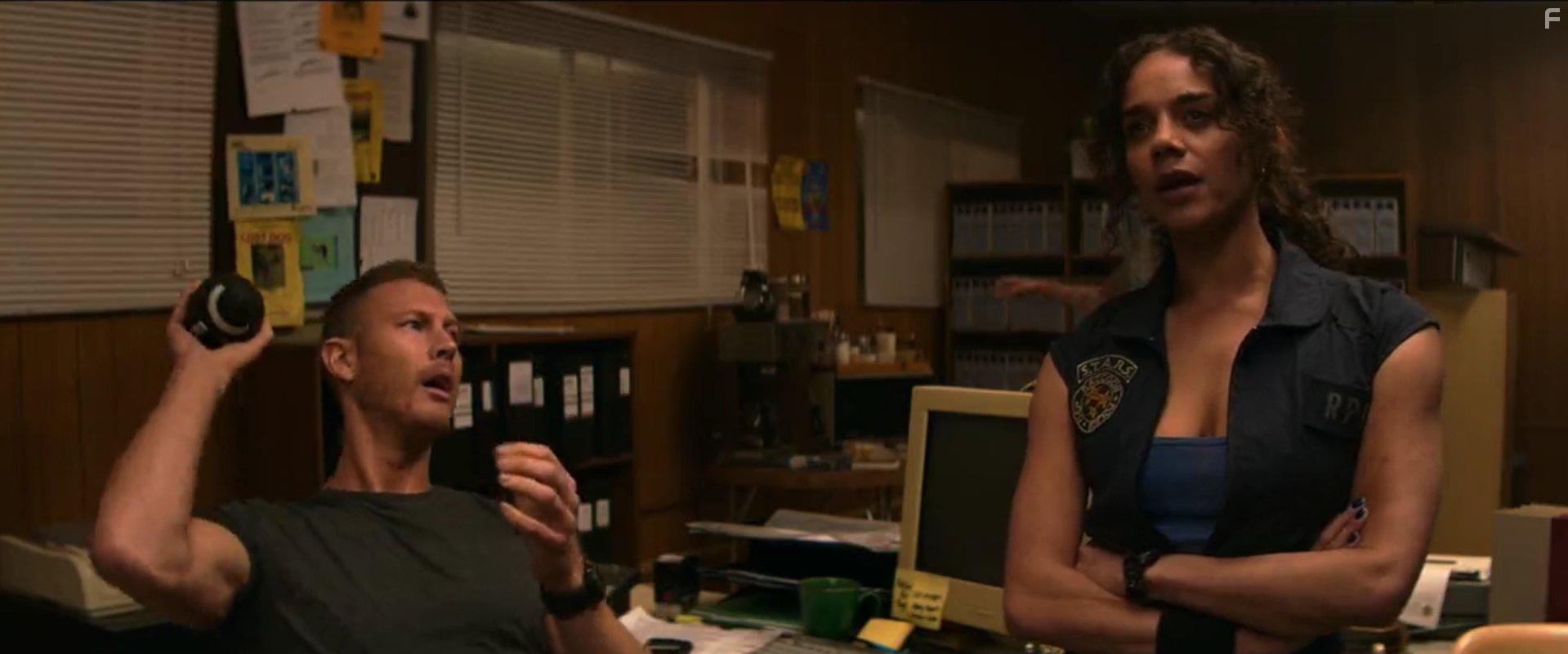 Tom Hopper and Hannah John-Kamen in Resident Evil: Welcome to Raccoon City (2021)