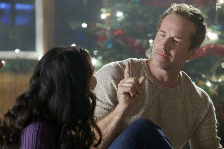 Veronica Marin-Estrada and Paul Greene in Christmas CEO (2021)