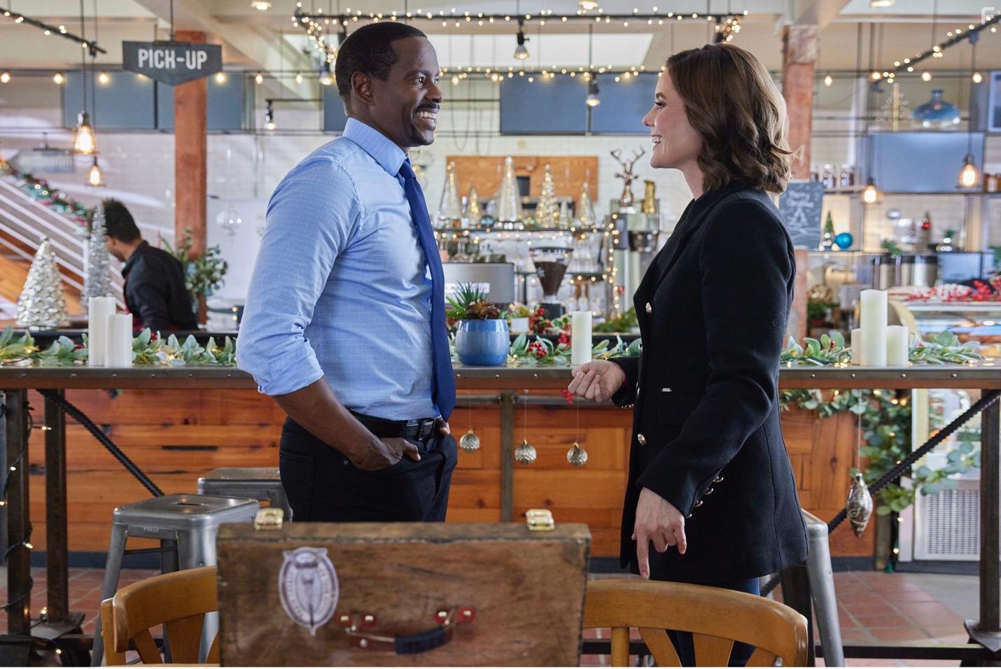 Keith D. Robinson and Ashley Williams in Sister Swap: Christmas in the City (2021)