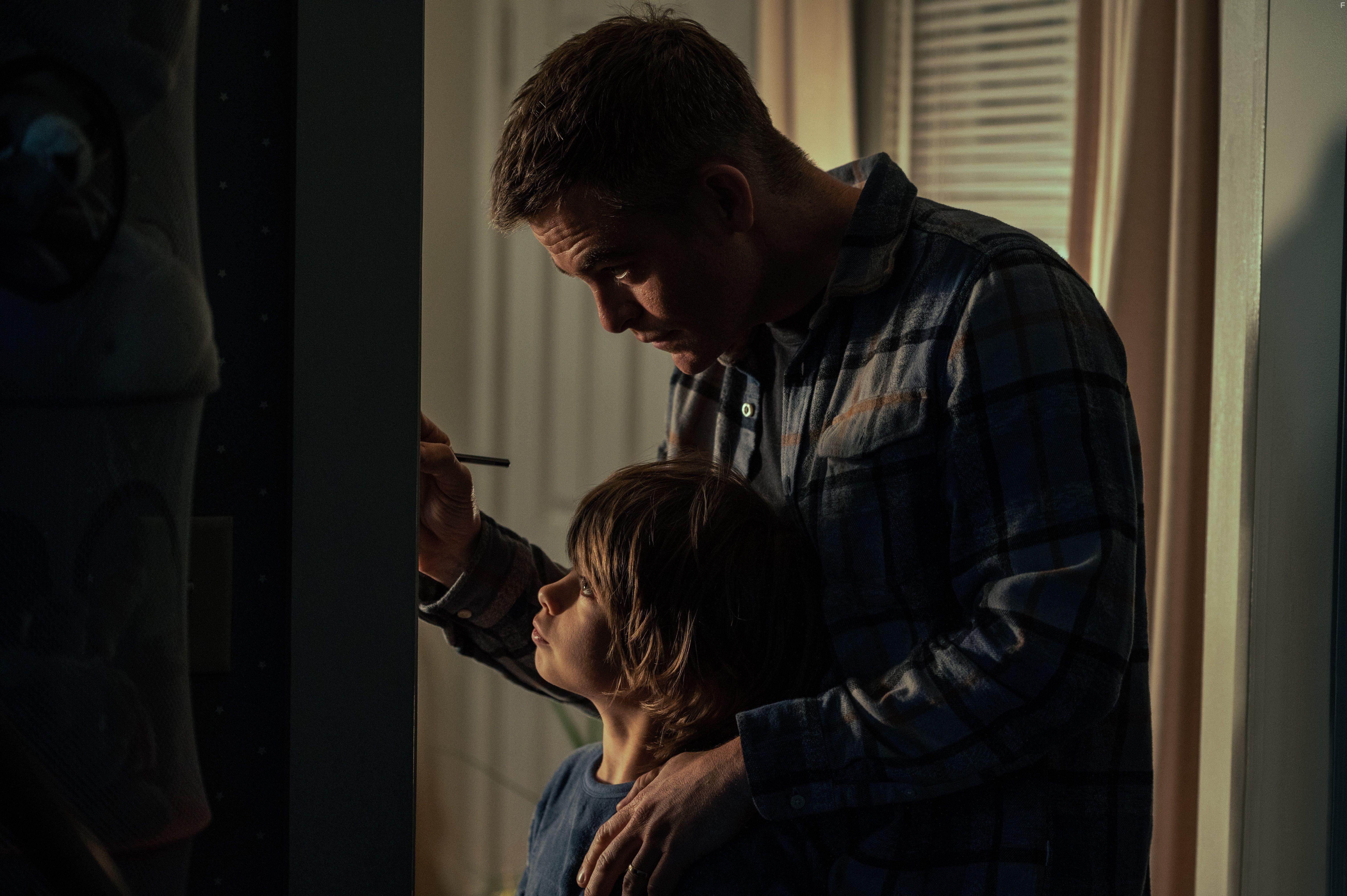 Chris Pine and Sander Thomas in The Contractor (2022)