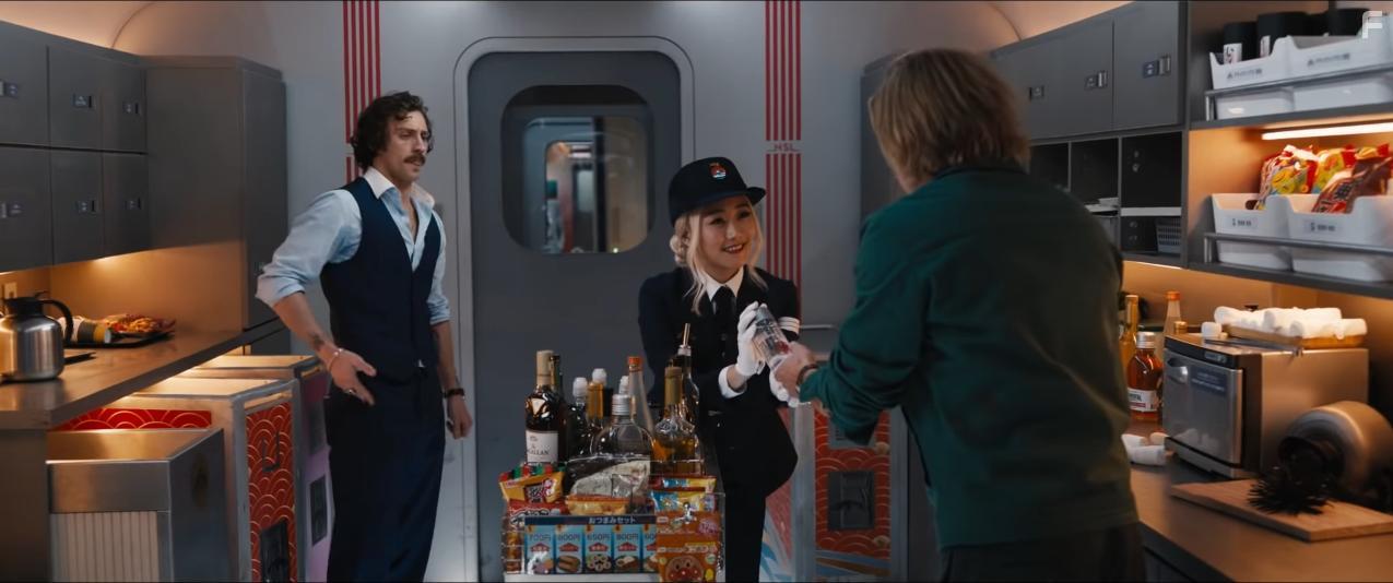 Brad Pitt, Aaron Taylor-Johnson, and Karen Fukuhara in Bullet Train (2022)
