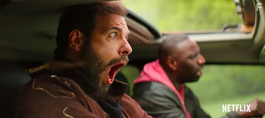 Laurent Lafitte and Omar Sy in Loin du priph (2022)