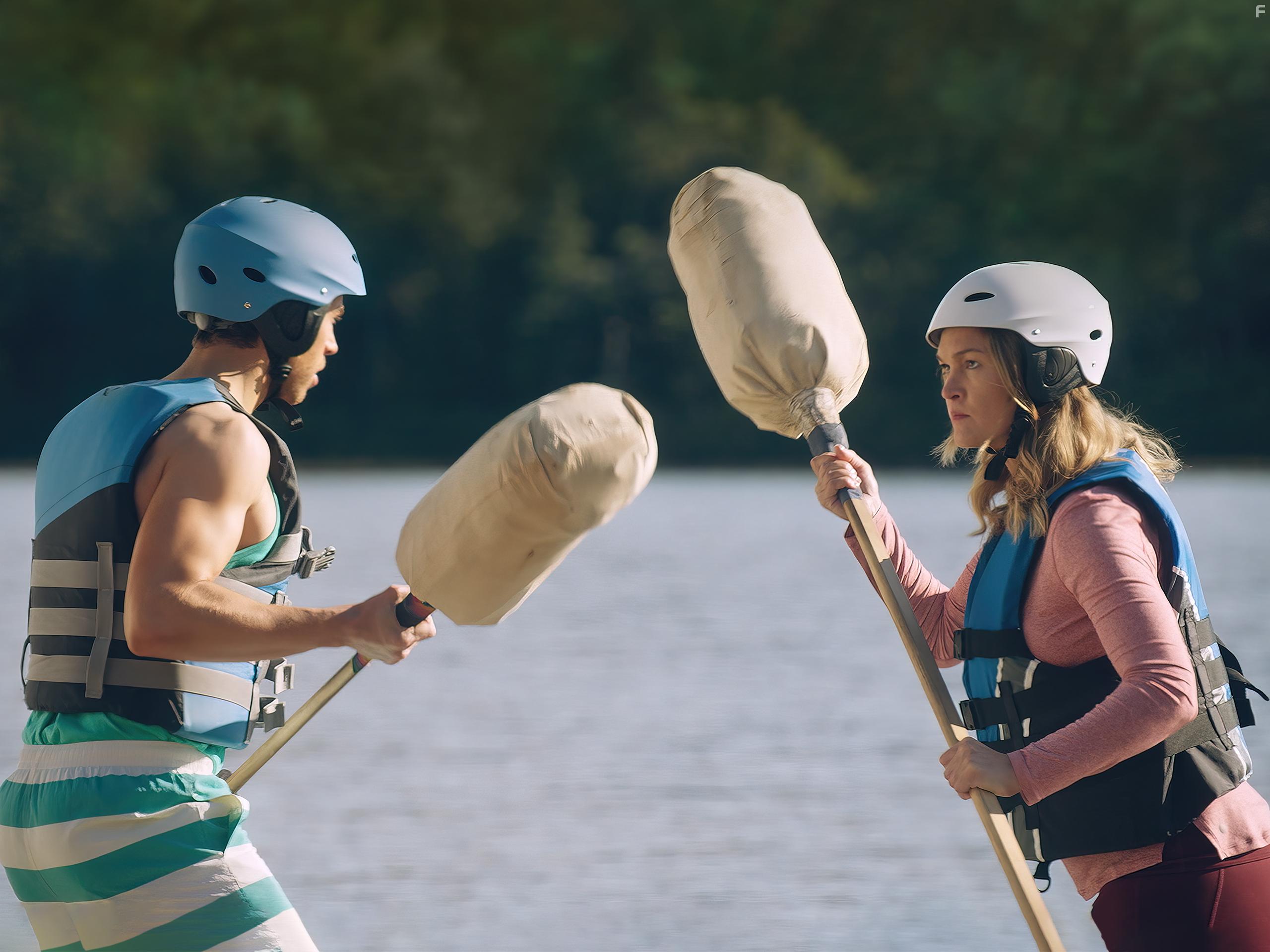 Julia Stiles and Jordan Gavaris in The Lake (2022)