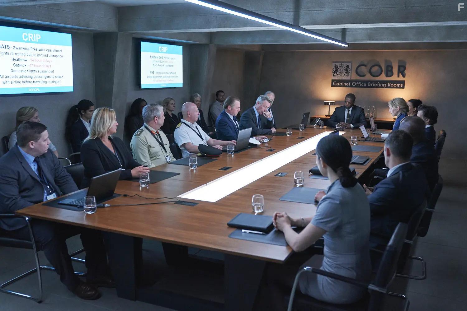 Alex Jennings, Adrian Lester, Simon Pegg, and Hannah Khalique-Brown in The Undeclared War (2022)