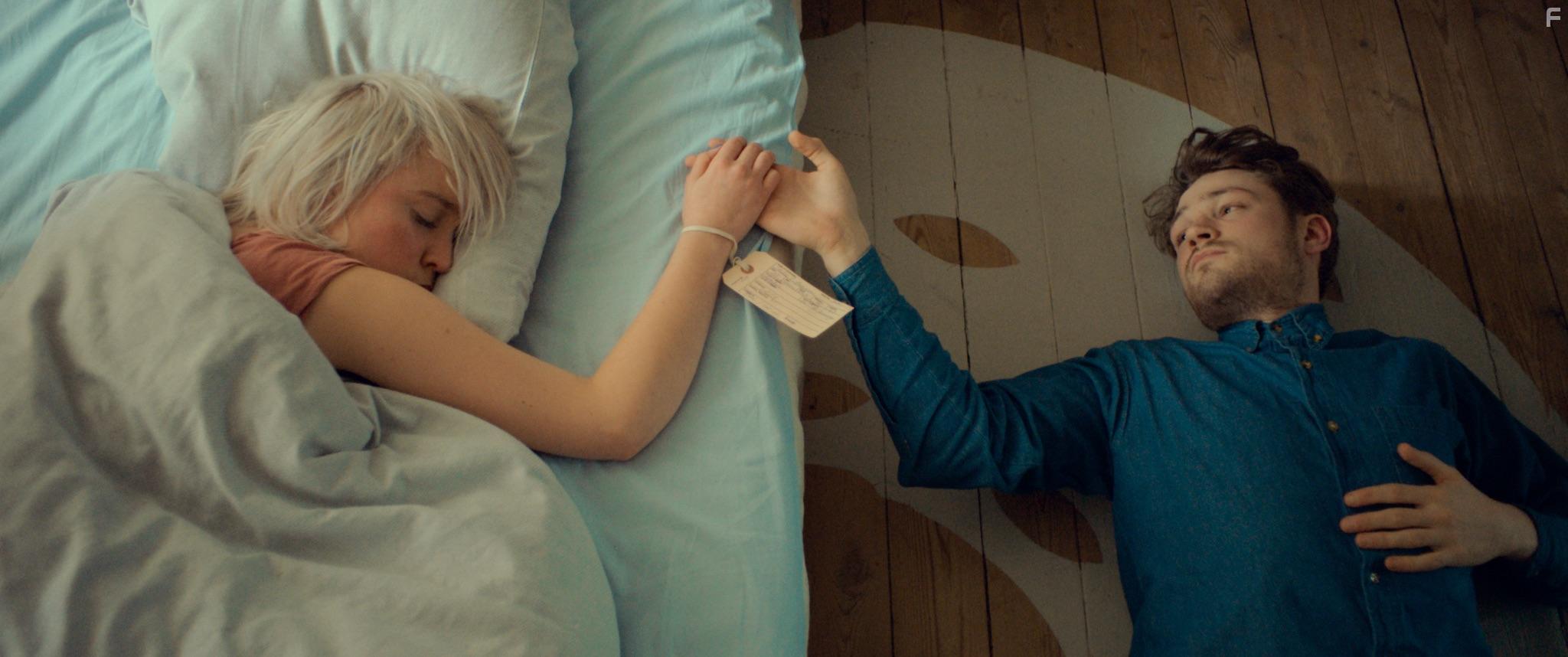 Olivia Vinall and Mark Strepan in A Beautiful Curse (2021)