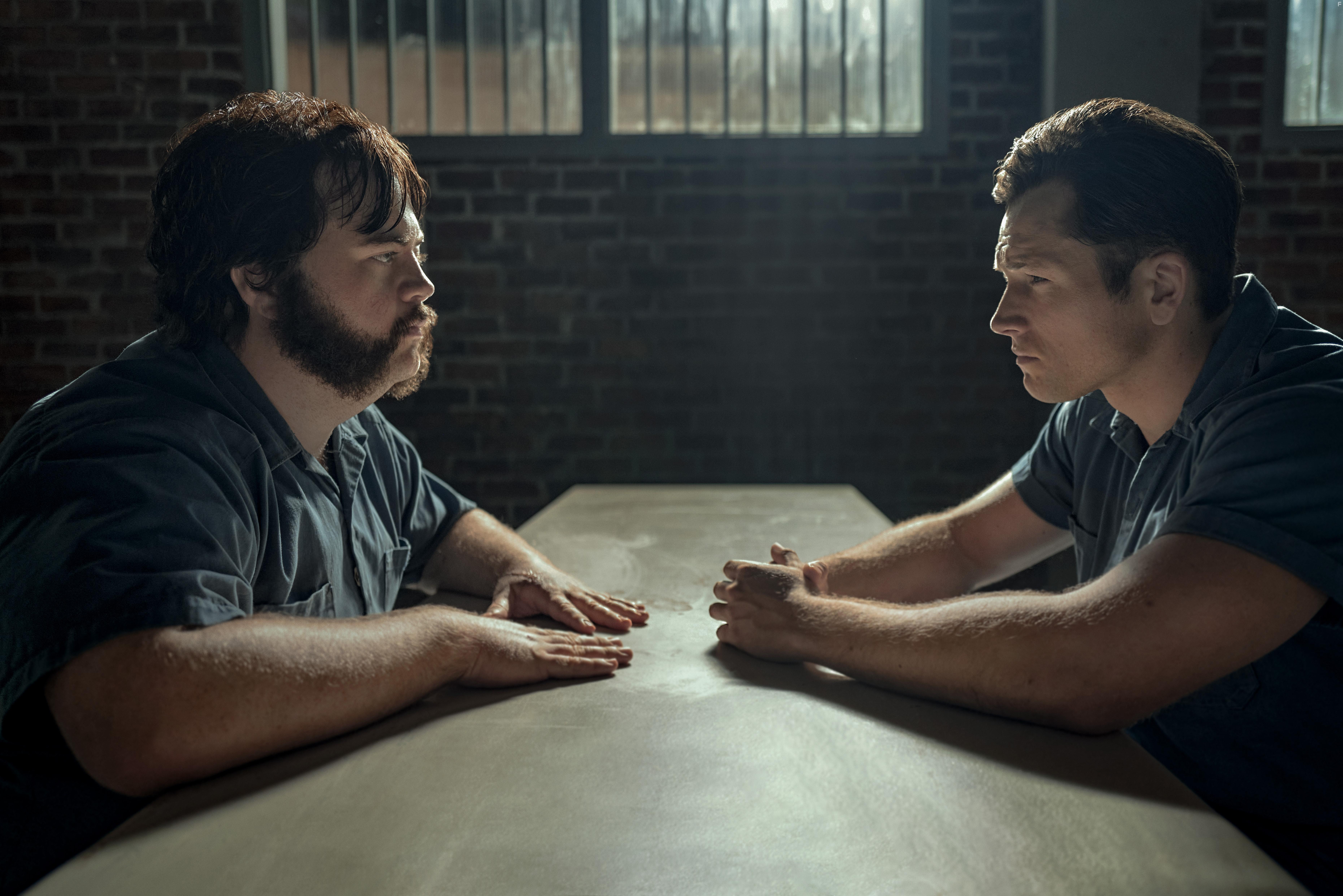 Paul Walter Hauser and Taron Egerton in Black Bird: Hand to Mouth (2022)