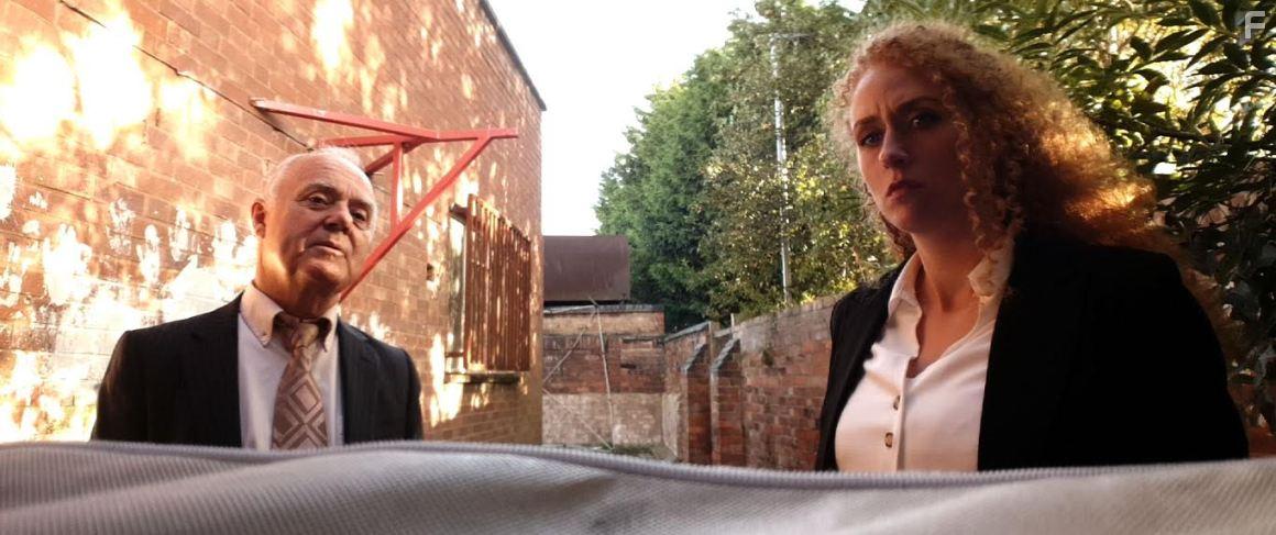 Anneka Kinch and Norman Hockley in Surveilled (2021)