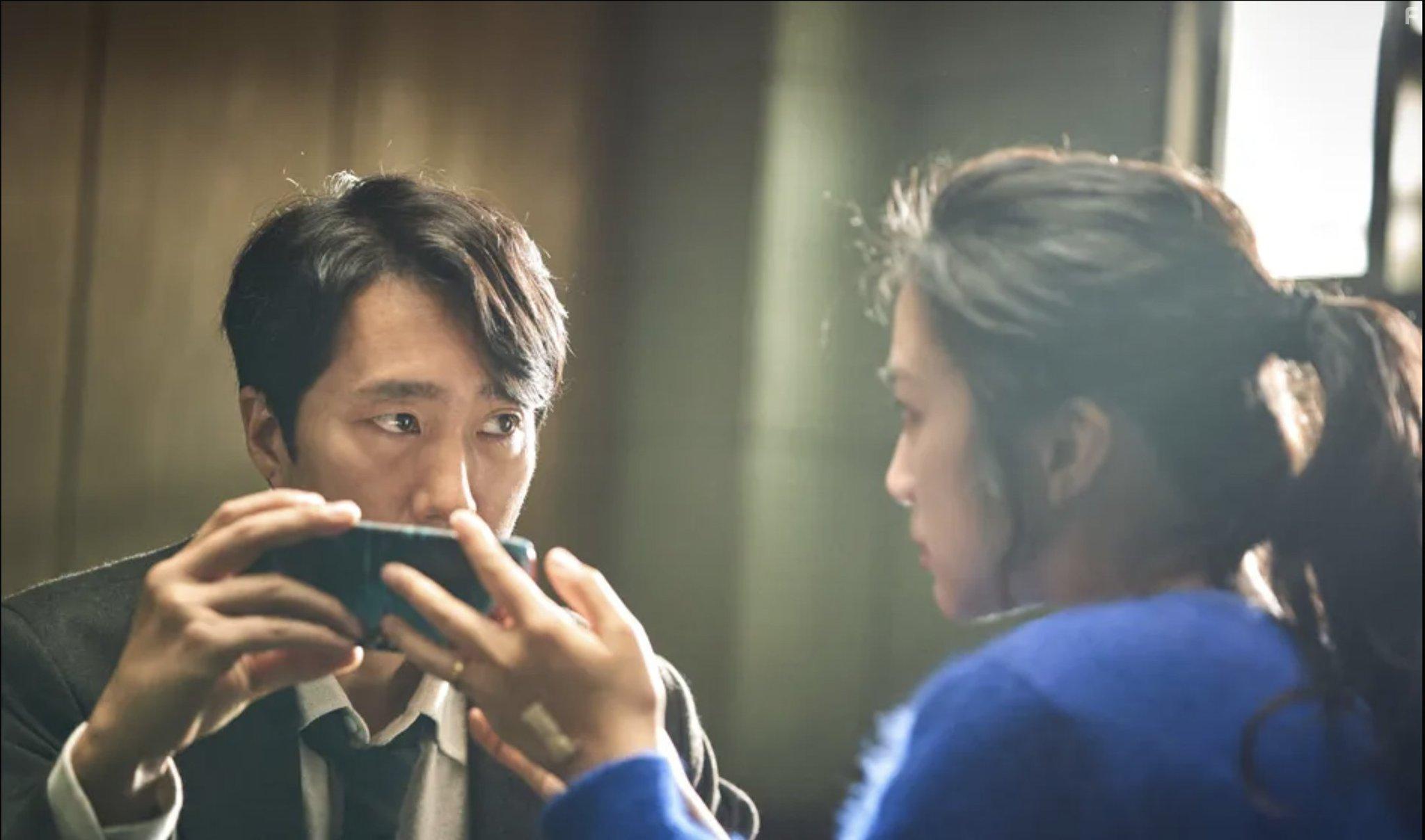 Park Hae-il and Tang Wei in Decision to Leave (2022)