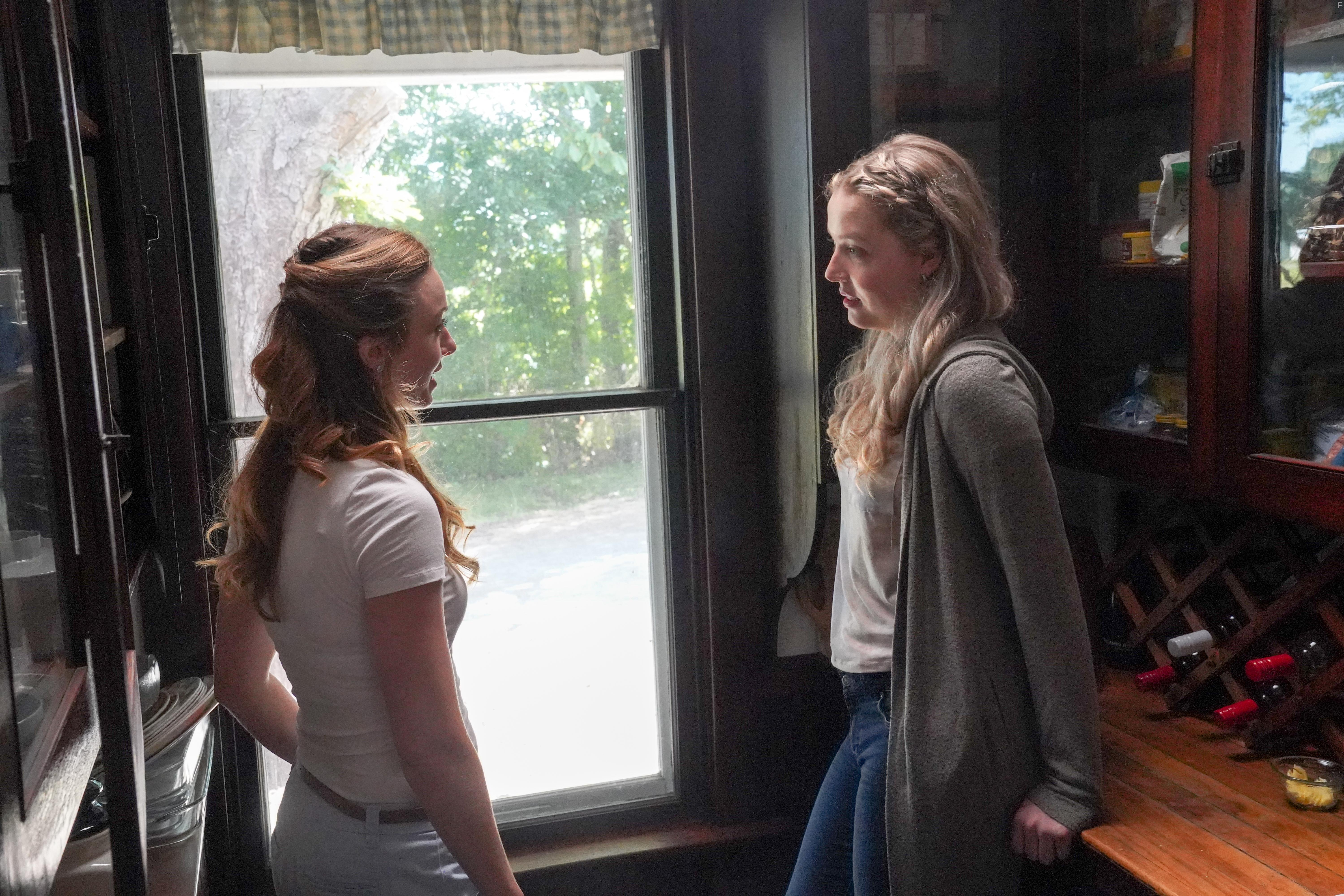 Amy Groening and Maya V. Henry in Dawn, Her Dad & the Tractor (2021)