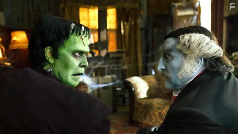 Jeff Daniel Phillips and Daniel Roebuck in The Munsters (2022)