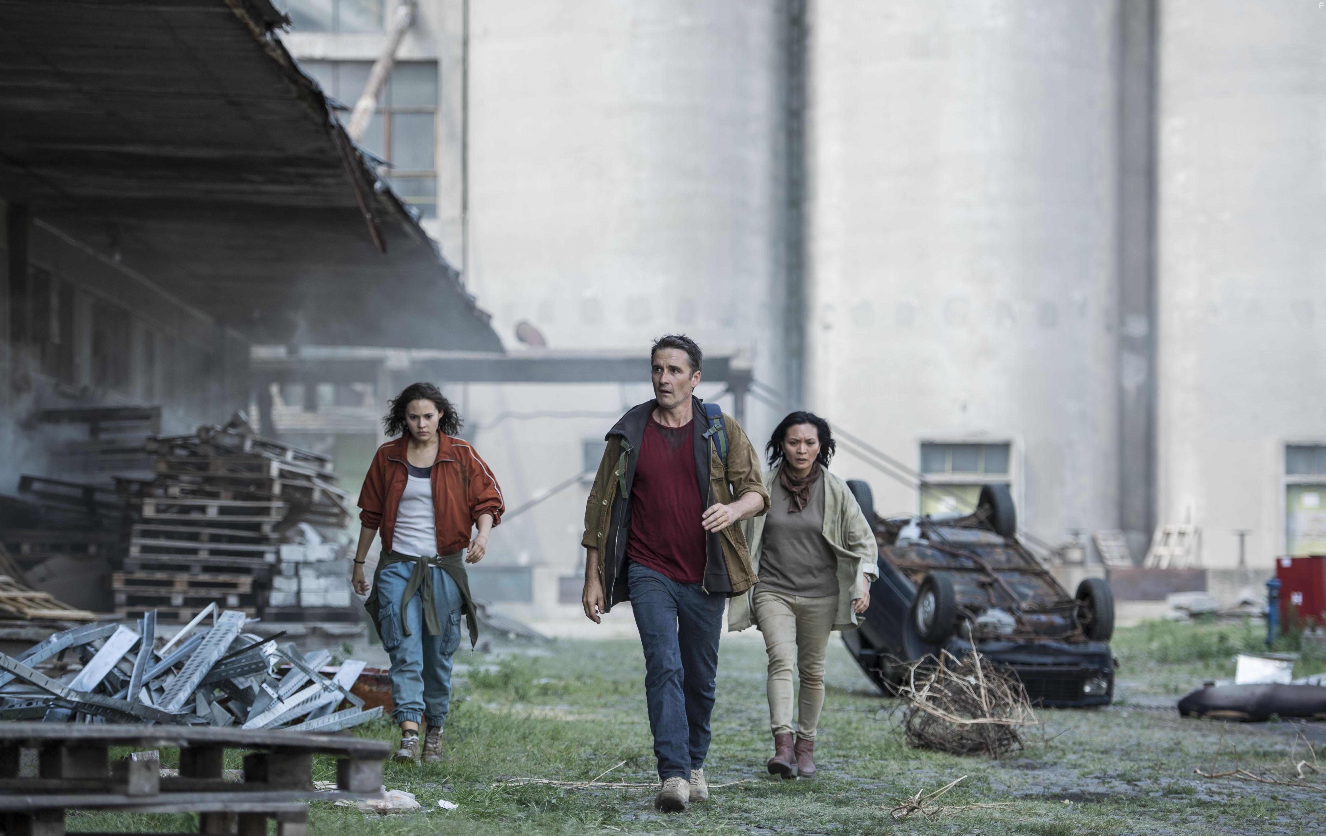 Alastair Mackenzie, Sumalee Montano, and Emma Fischer in The Deal (2022)