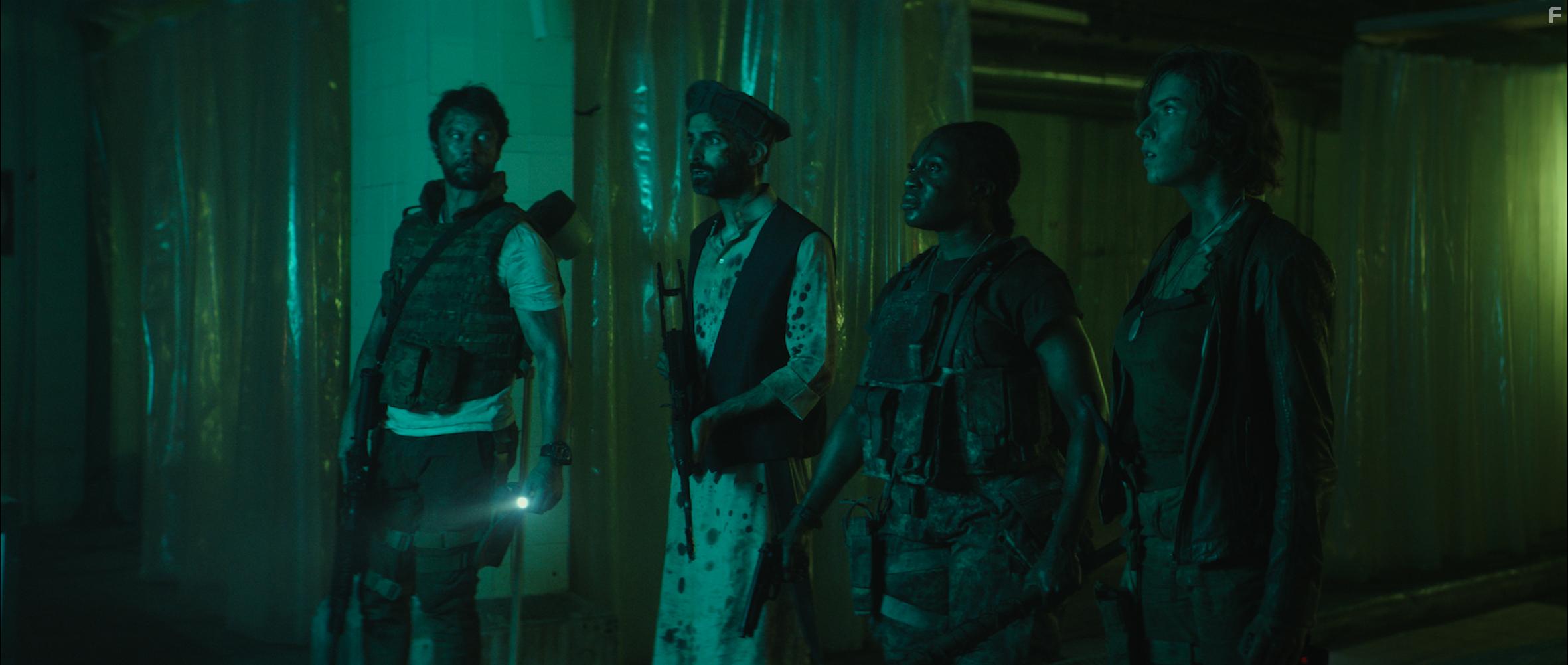 Kibong Tanji, Leon Ockenden, Charlotte Kirk, and Hadi Khanjanpour in The Lair (2022)