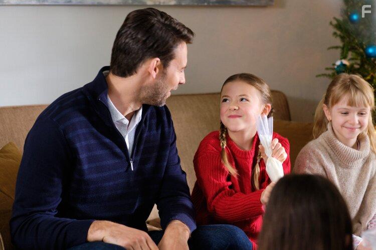 Alice Comer and Steve Lund in Christmas Bedtime Stories (2022)