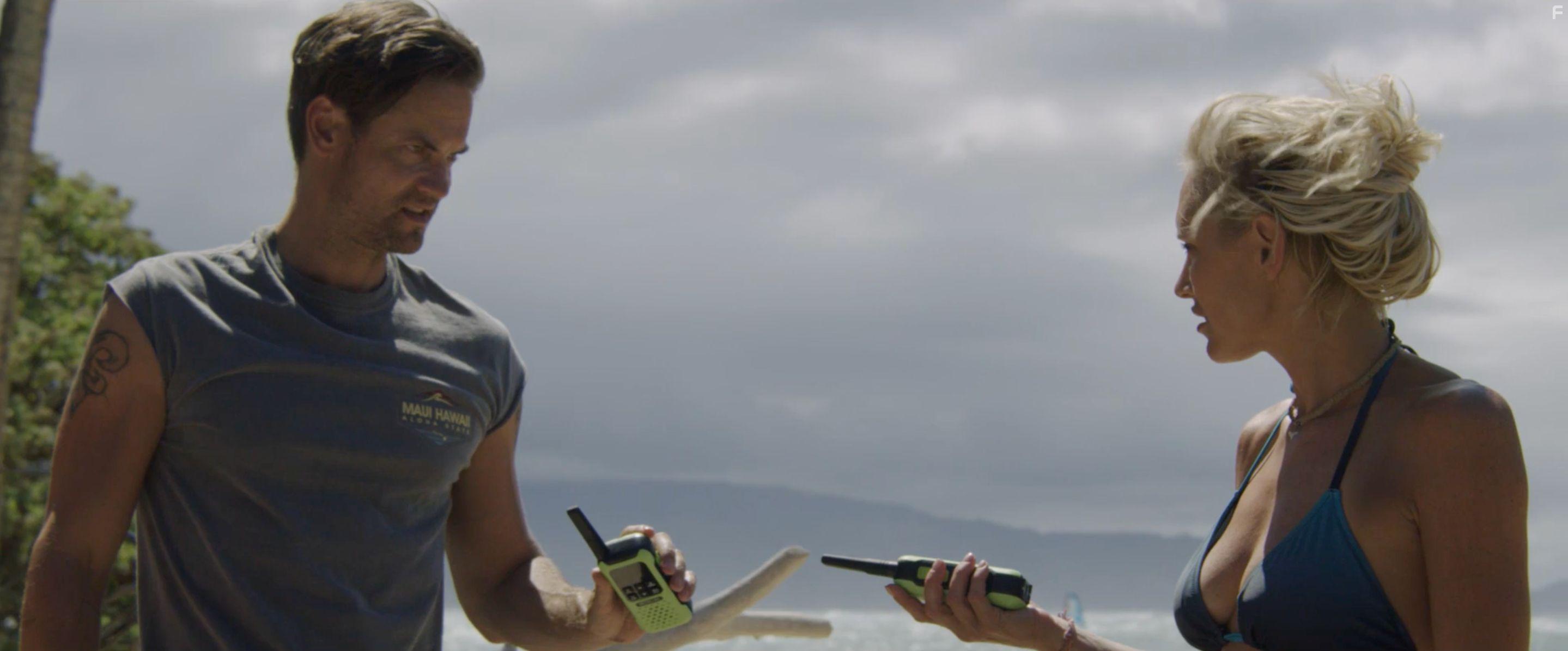 Shane West and Nicky Whelan in Maneater (2022)