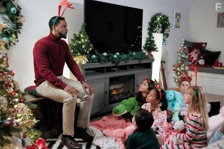 Isabel Birch and Ronnie Rowe in Inventing the Christmas Prince (2022)