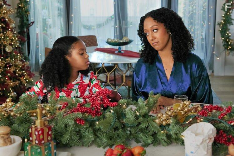 Tamera Mowry-Housley and Isabel Birch in Inventing the Christmas Prince (2022)