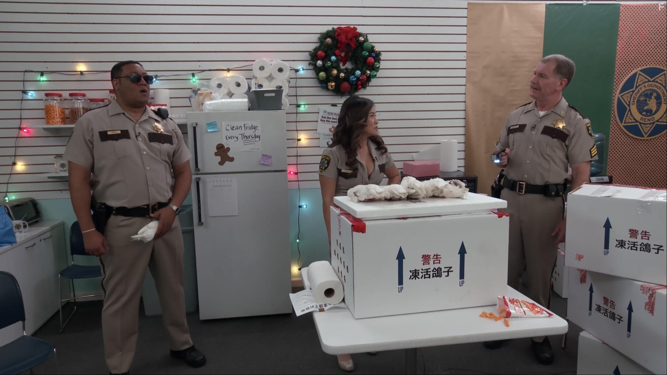 Ian Roberts, Cedric Yarbrough, and Wanru Tseng in Reno 911!: It's a Wonderful Heist (2022)