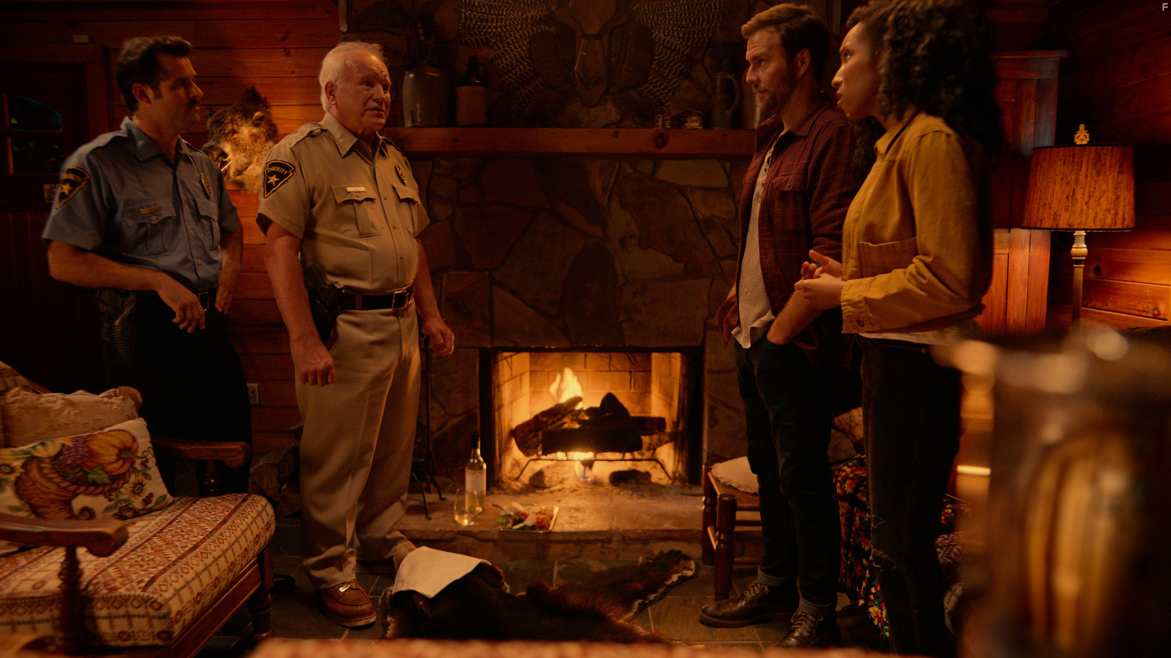 Alex (Justin Miles) and his new fiance Zoe (Andrea Laing) get a disturbing visit from the local sheriff (Mark Costello) and his deputy (Jonathon Pawlowski)