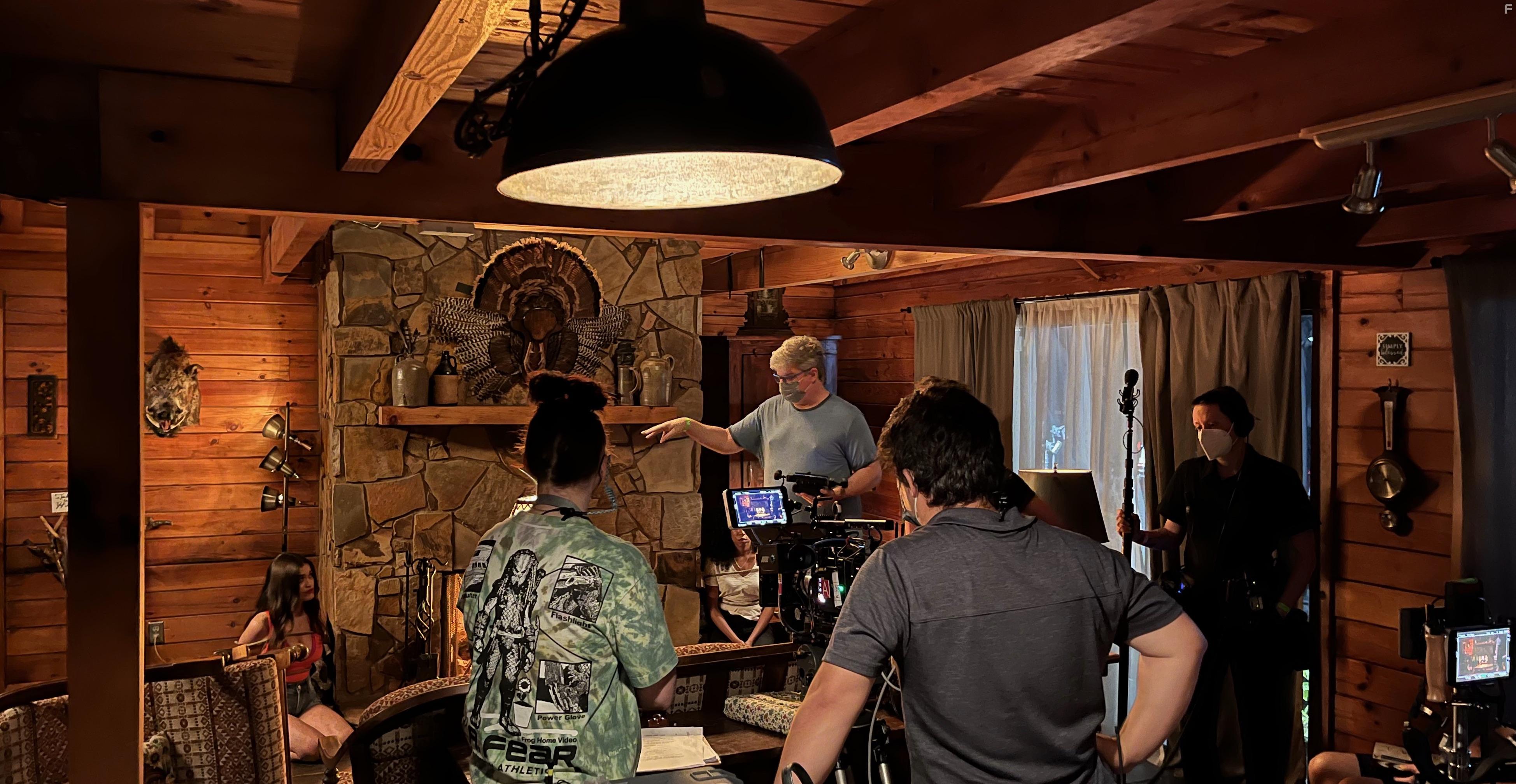 Casper Kelly directs a scene with Holly (Danielia Maximillian) and Zoe (Andrea Laing).