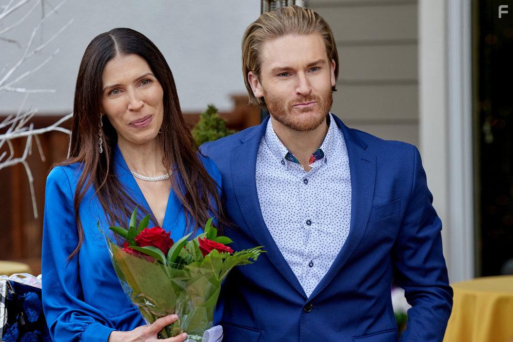 Amanda May and Neil Webb in Grilling Season: A Curious Caterer Mystery (2023)