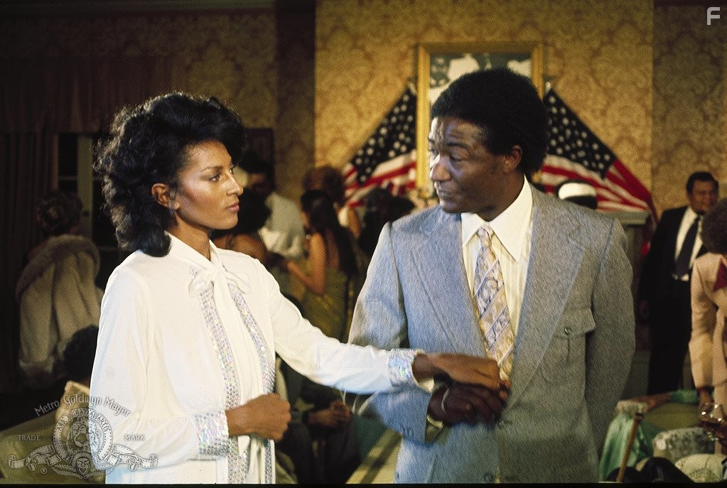 Pam Grier and Paul Benjamin in Friday Foster (1975)