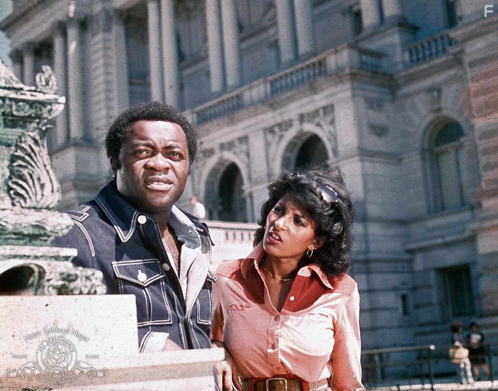 Pam Grier and Yaphet Kotto in Friday Foster (1975)
