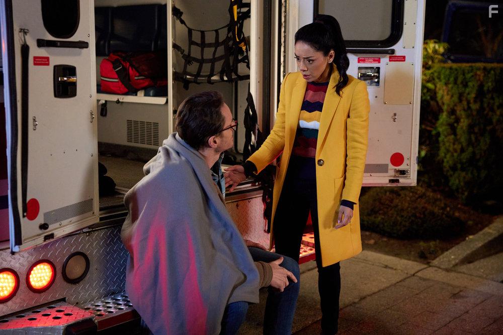 Aimee Garcia and Paul Campbell in The Cases of Mystery Lane (2023)
