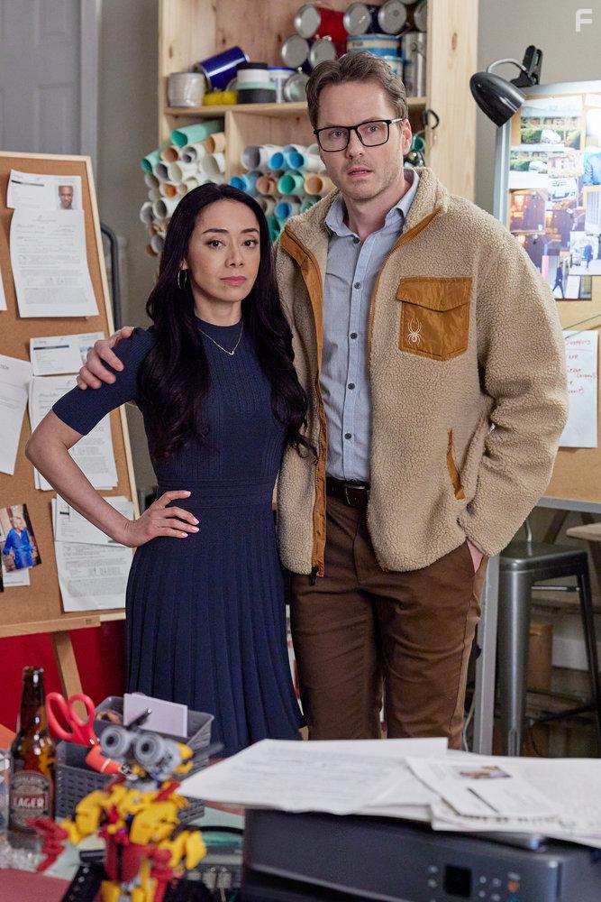 Aimee Garcia and Paul Campbell in The Cases of Mystery Lane (2023)