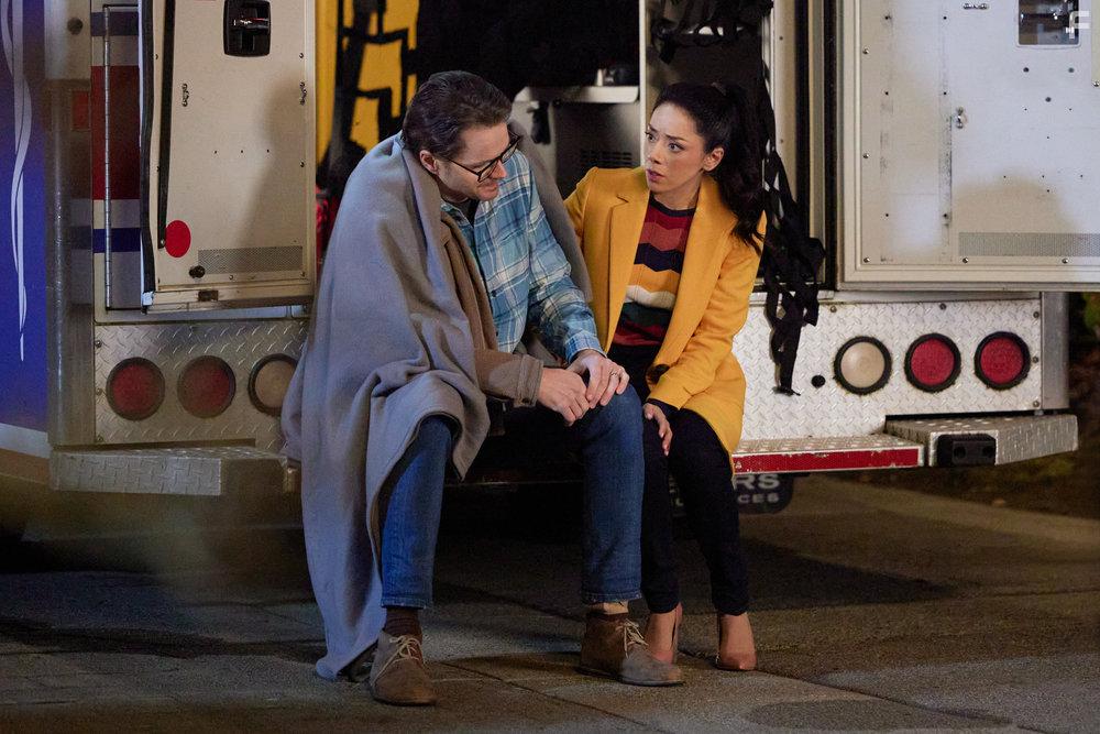 Aimee Garcia and Paul Campbell in The Cases of Mystery Lane (2023)
