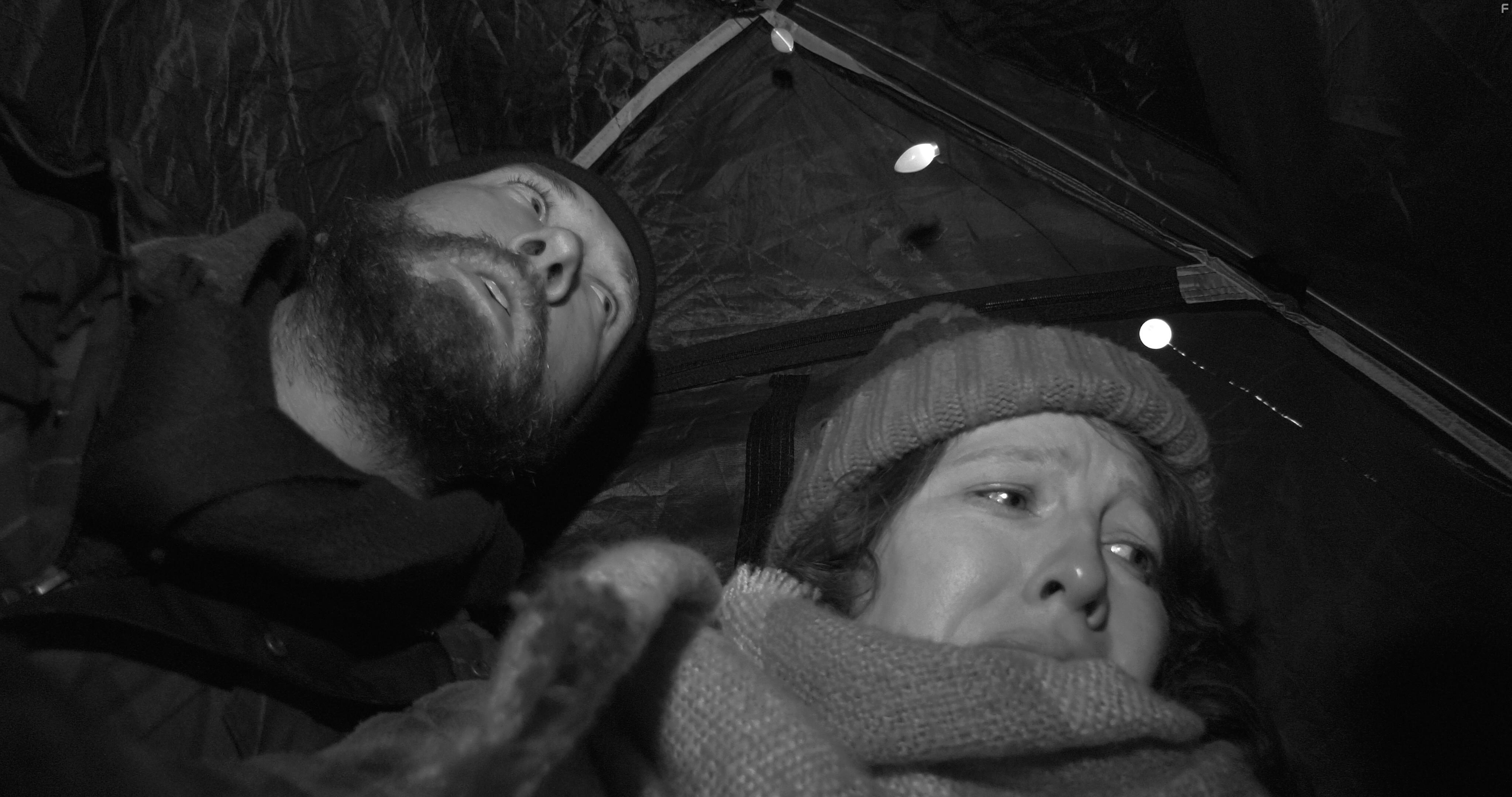 Caleb Lush and Louise Harding in The Christmas Tapes (2022)