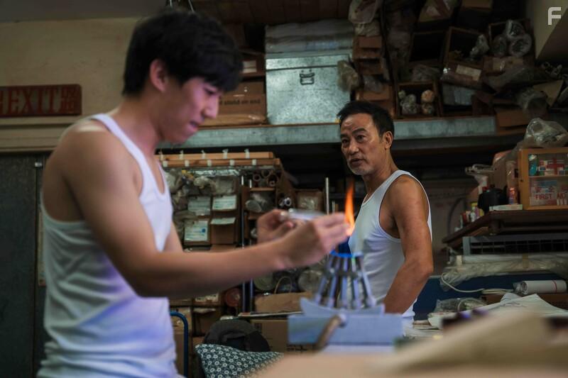 Simon Yam and Henick Chou in A Light Never Goes Out (2022)