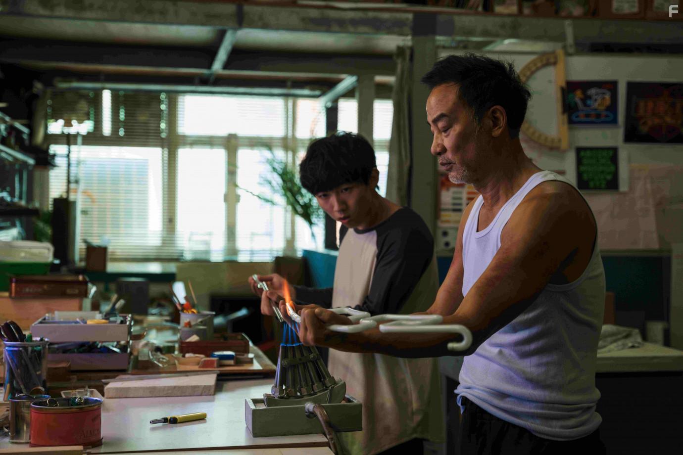 Simon Yam and Henick Chou in A Light Never Goes Out (2022)