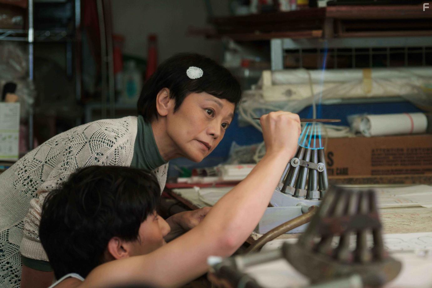 Sylvia Chang and Henick Chou in A Light Never Goes Out (2022)