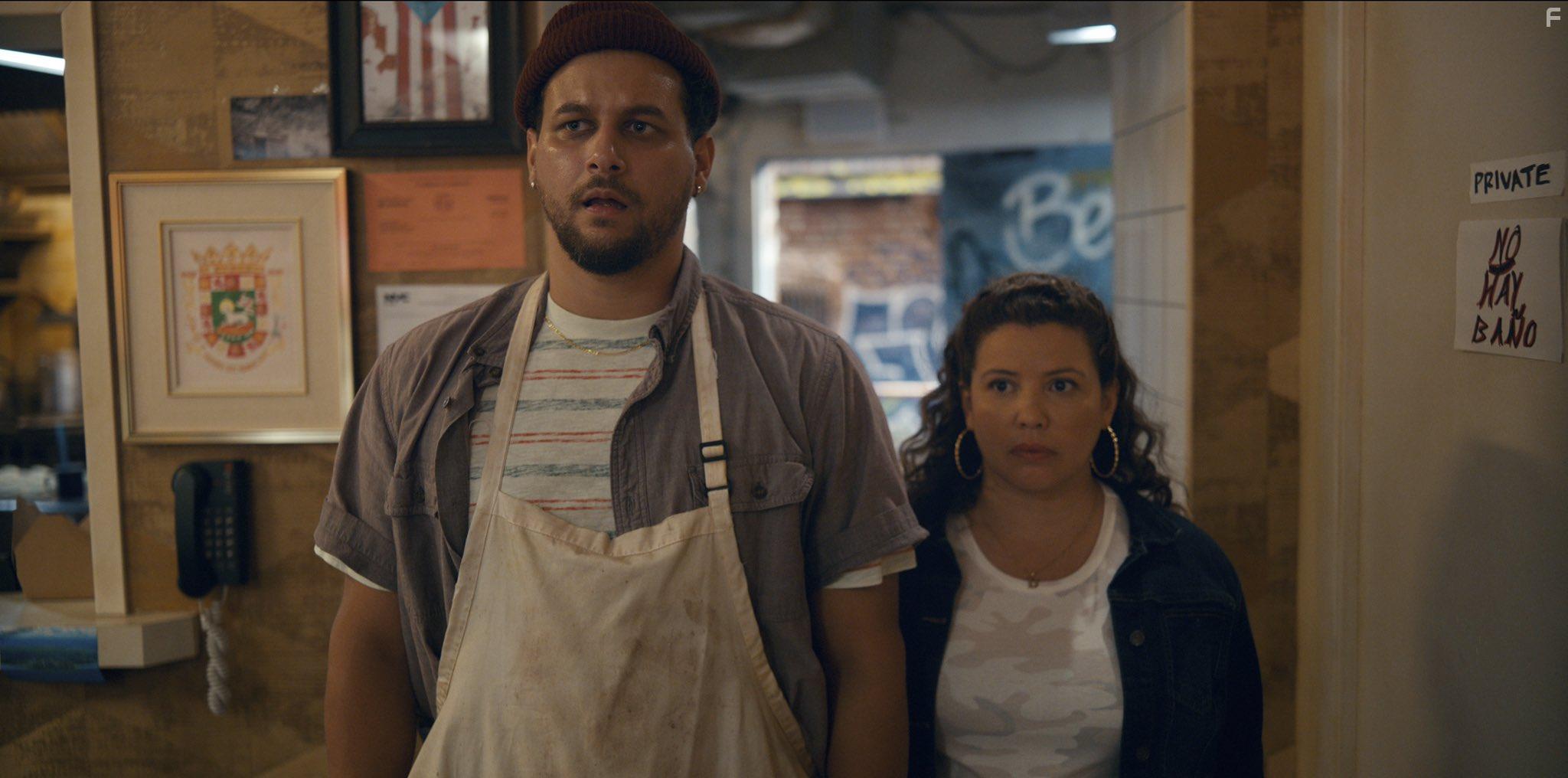 Justina Machado and Alejandro Hernandez in The Horror of Dolores Roach (2023)
