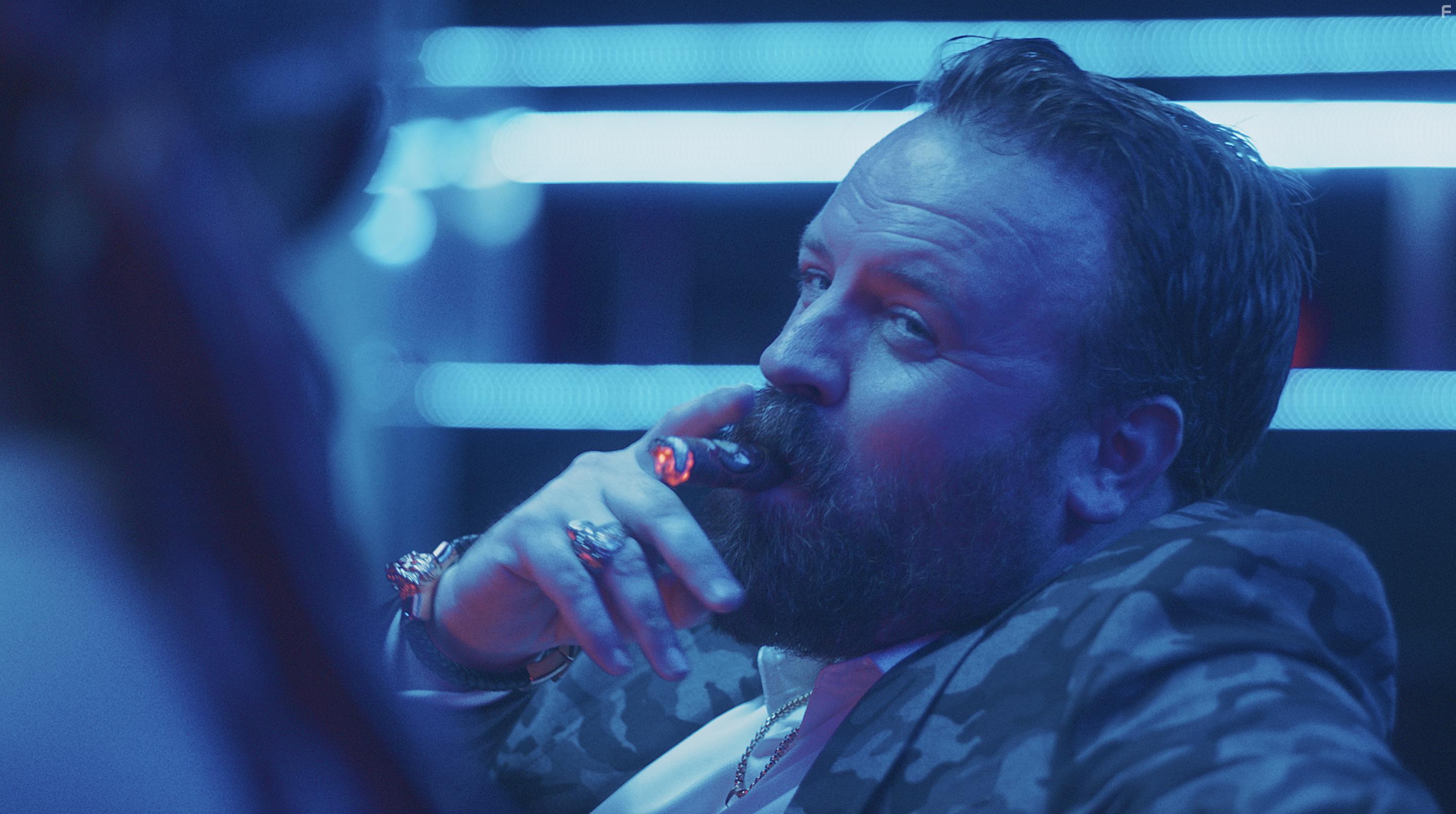 Simon Phillips in Escaping Paradise (2022)