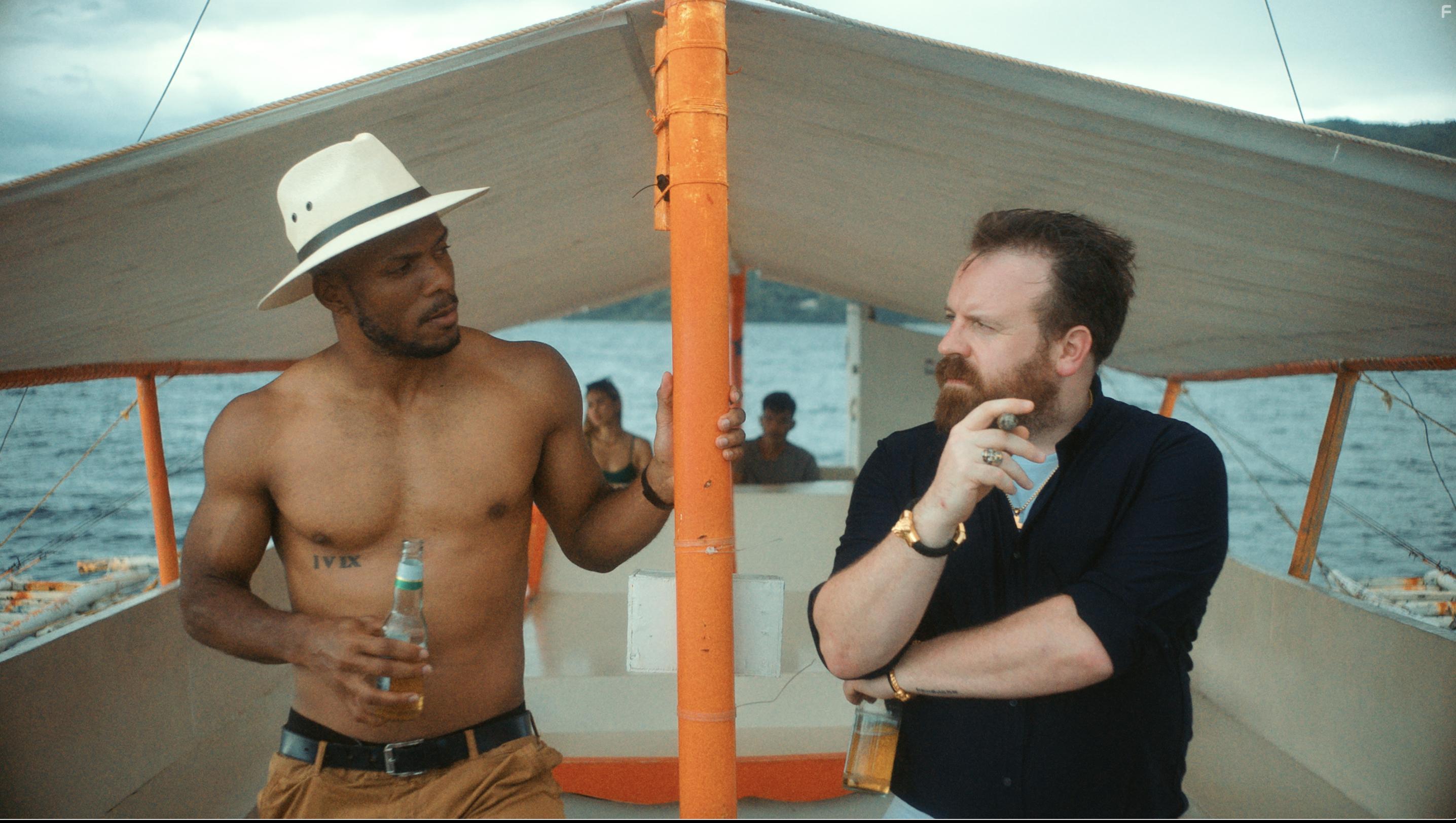 Deji LaRay and Simon Phillips in Escaping Paradise (2022)