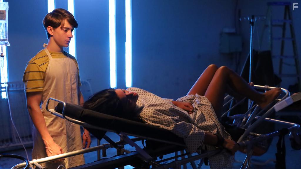 Gigi Zumbado and Tyler Sanders in The Price We Pay (2022)