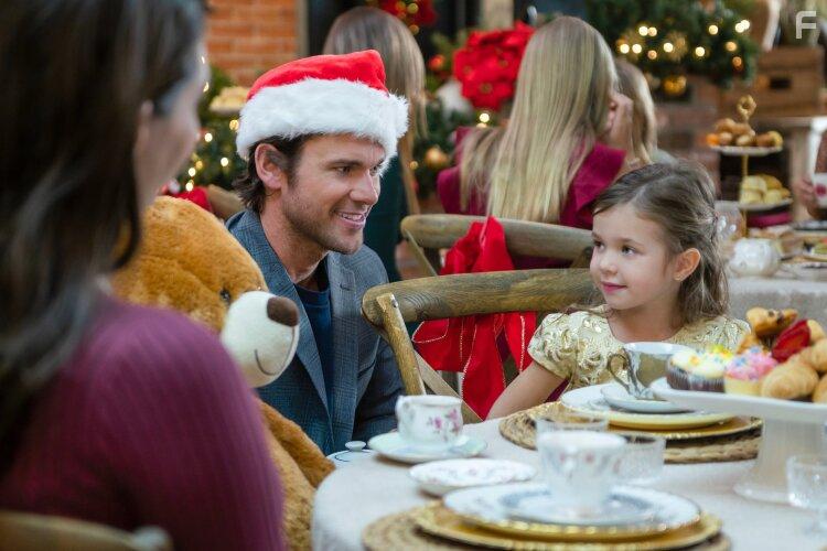Chloe McKinnon, Kevin McGarry, and Brittany Mitchell in Checkin' It Twice (2023)