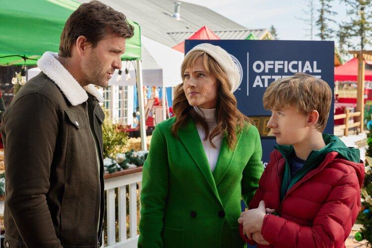 Nikki Deloach, Lucas Bryant, and Aias Dalman in A World Record Christmas (2023)