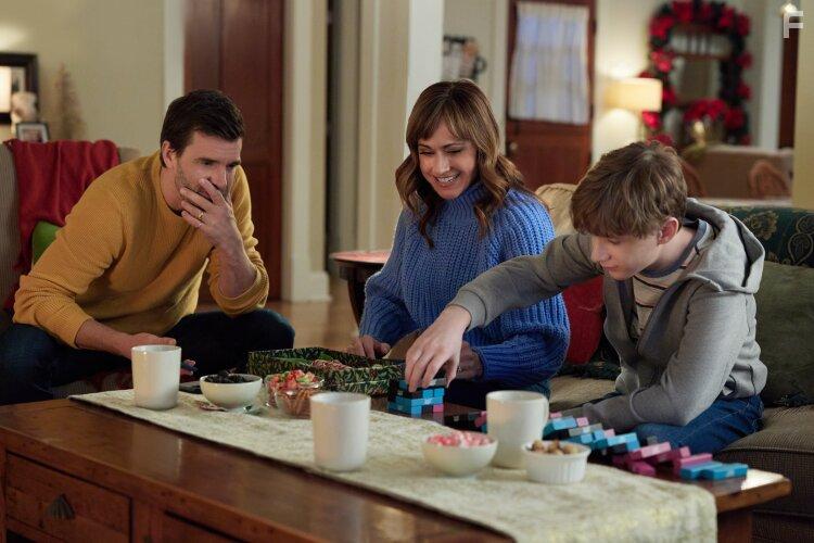 Nikki Deloach, Lucas Bryant, and Aias Dalman in A World Record Christmas (2023)