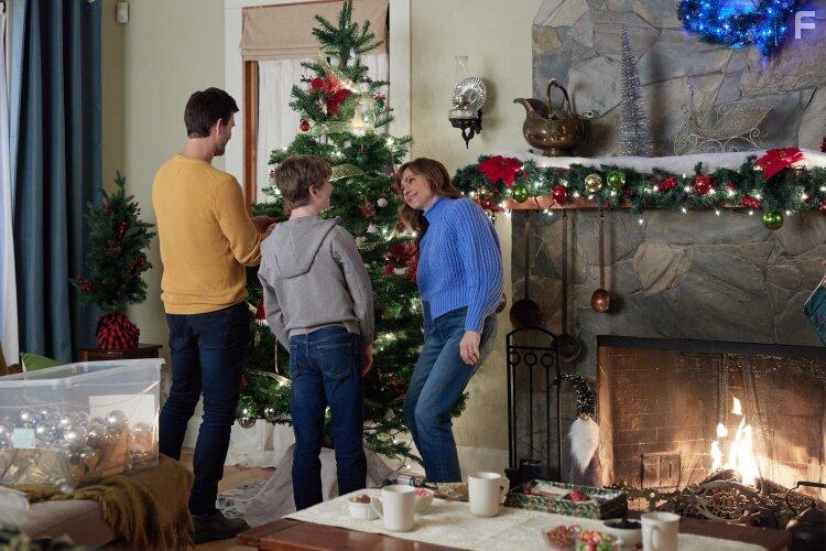 Nikki Deloach, Lucas Bryant, and Aias Dalman in A World Record Christmas (2023)