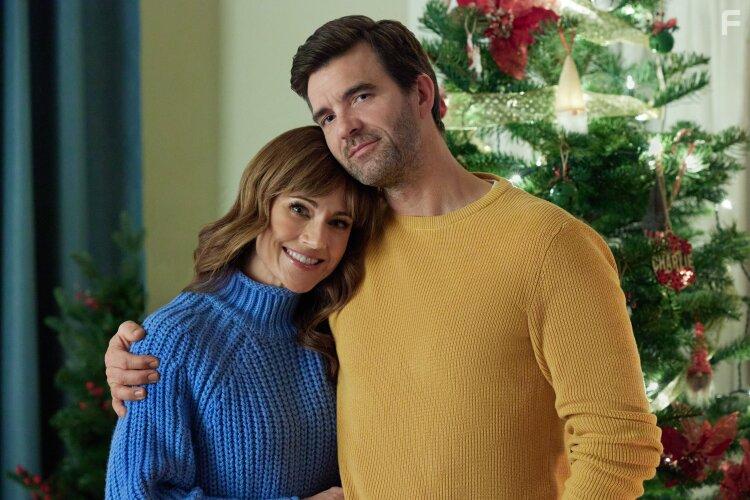 Nikki Deloach and Lucas Bryant in A World Record Christmas (2023)